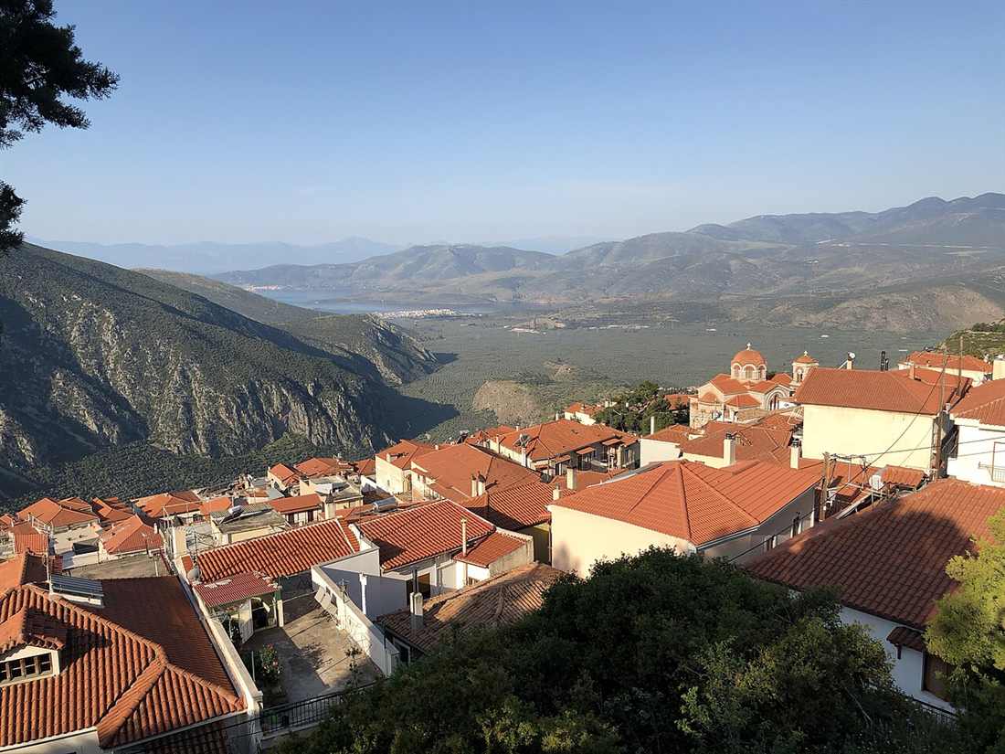 The modern village of Delphi on the slope of Mount Parnassus above the Pleistos gorge and the olive plain