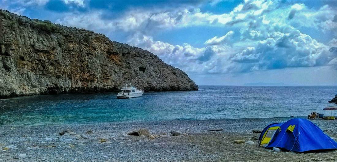 The turquoise cove of Menies beach below the Diktynna sanctuary on the Rodopou peninsula, Crete