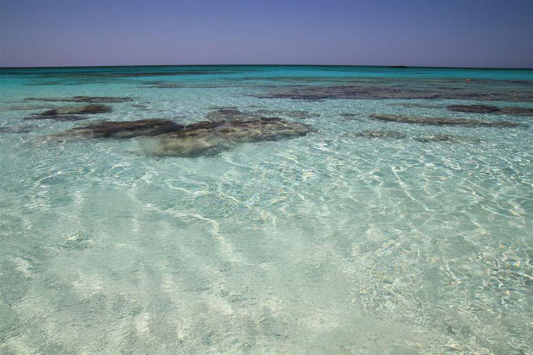 The shallow turquoise lagoon of Elafonisi beach, the trip from Chania