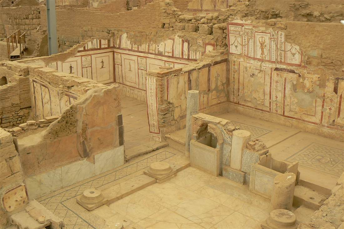 A frescoed room of the Terrace Houses of Ephesus with painted panel walls and a mosaic floor