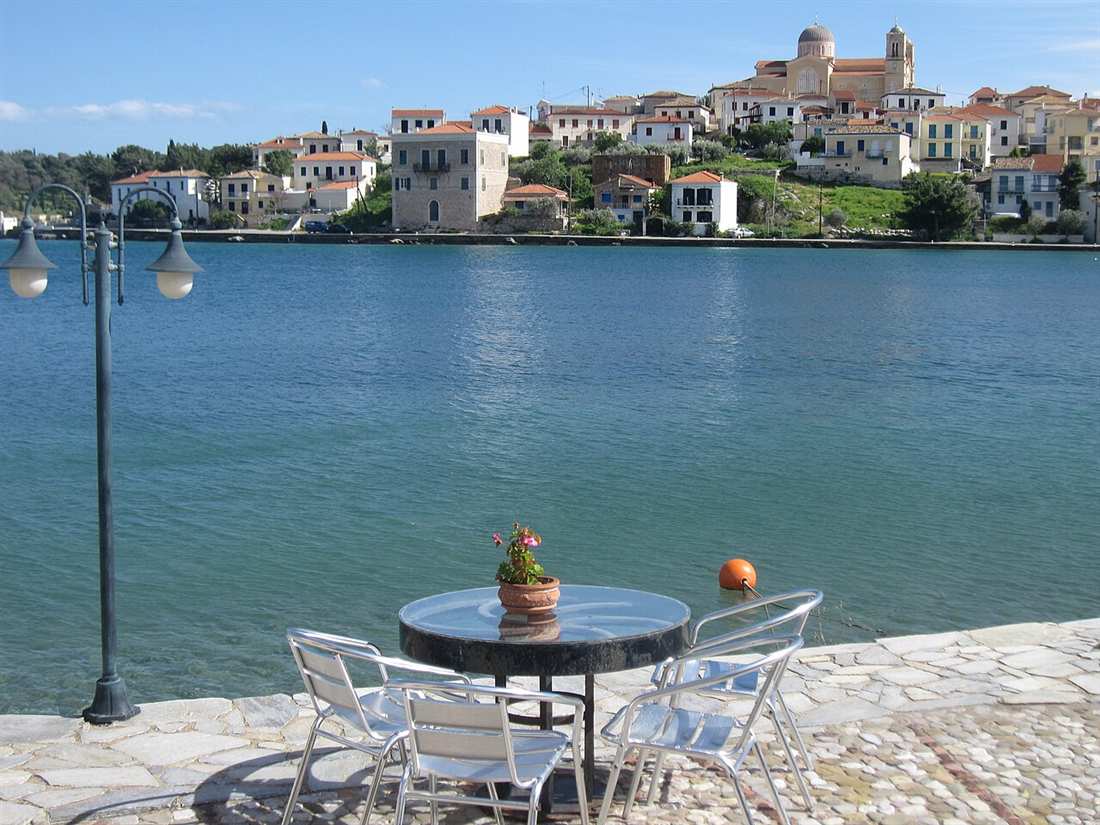Galaxidi seen across its harbour, the church of Agios Nikolaos crowning the stone town