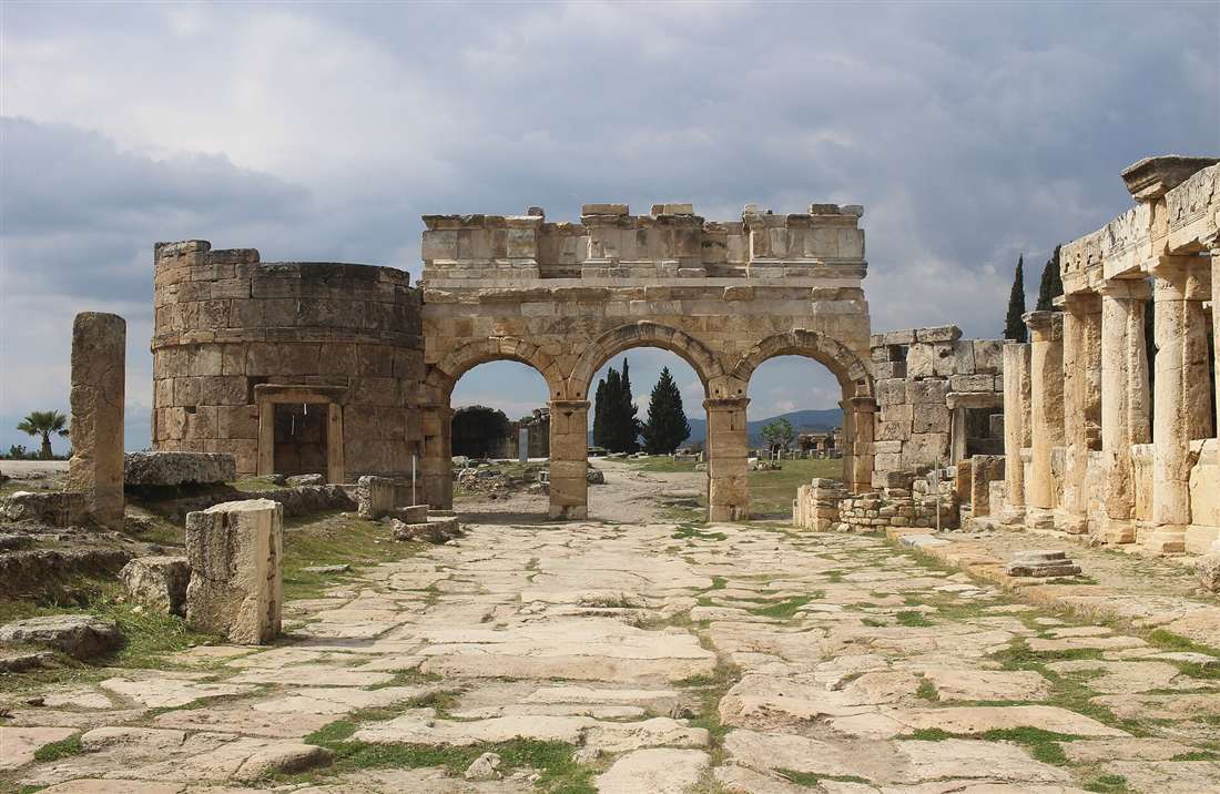 The triple-arched Frontinus Gate and its round towers at Hierapolis