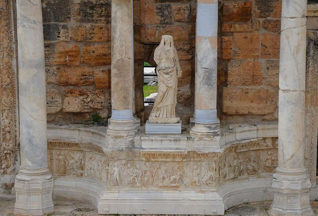 The ornate marble stage building of the theatre of Hierapolis with its statue and reliefs