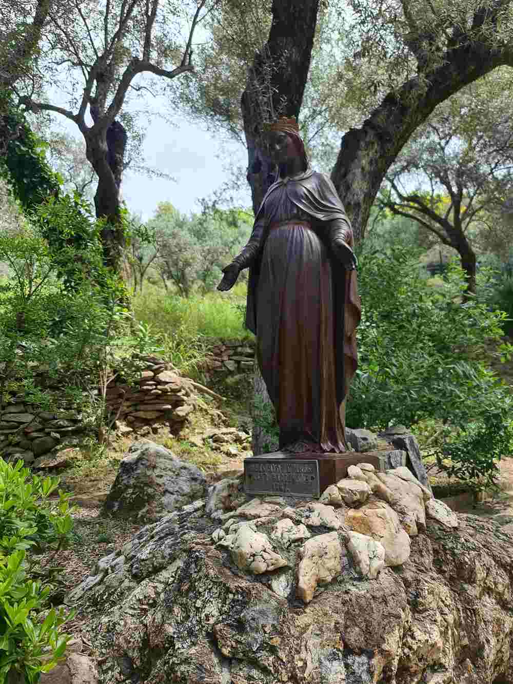 The bronze statue of the Virgin Mary in the garden of the shrine near Ephesus