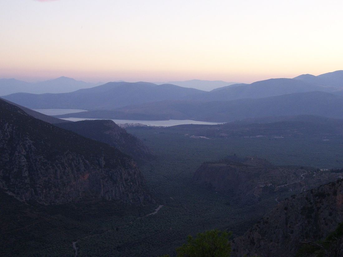 The olive plain and the Gulf of Corinth seen from Delphi at dusk on the road up from Athens