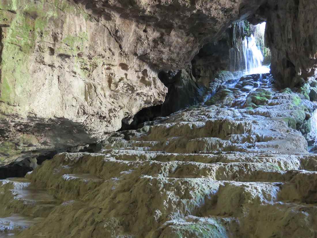 The white travertine terraces and waterfall inside Kaklik Cave, the underground Pamukkale