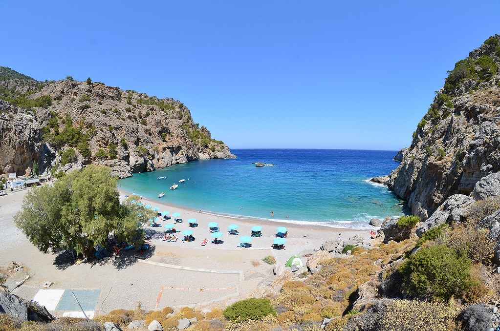 A sheltered, rocky-edged cove with clear water on Karpathos, good for snorkelling