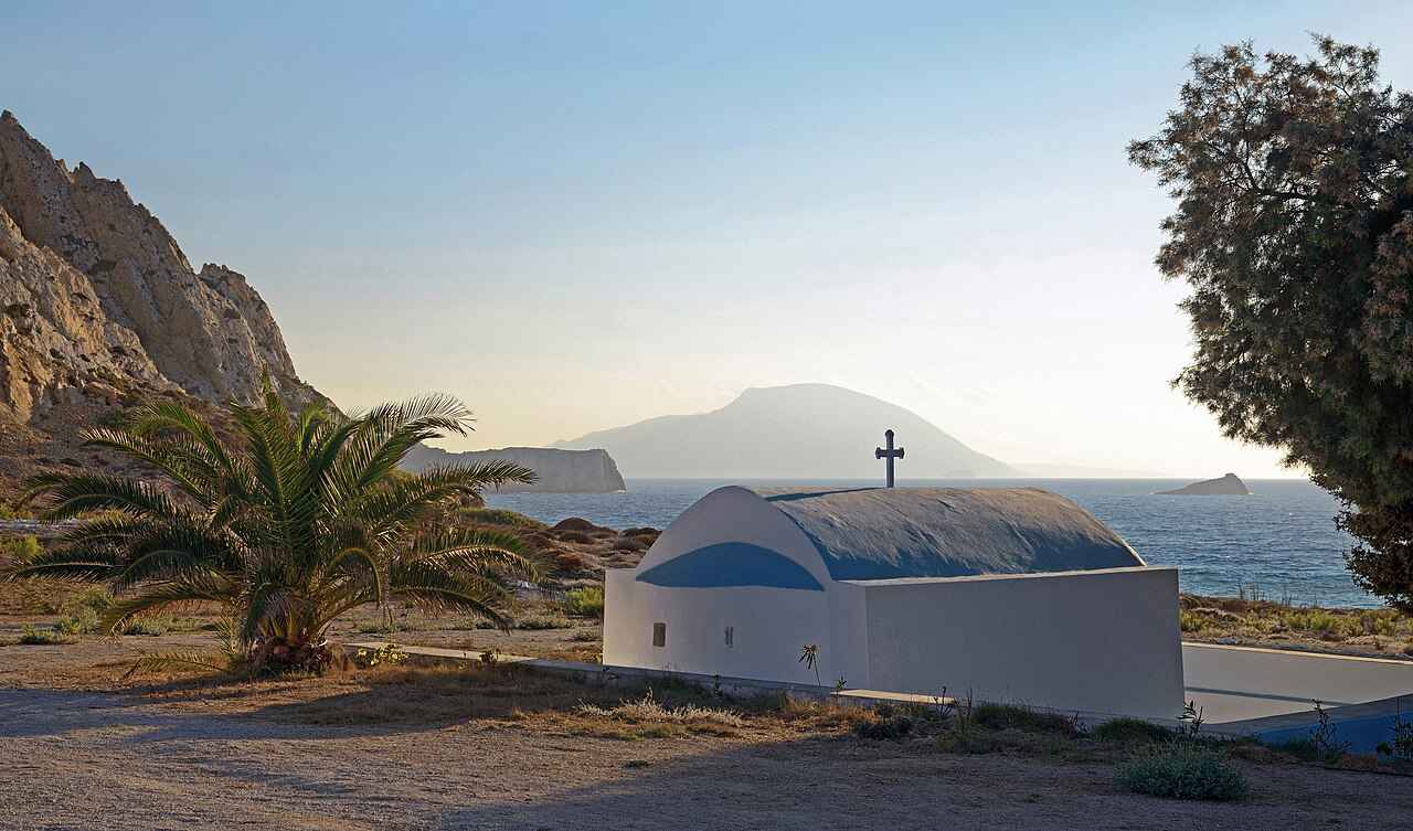 The chapel of Agios Nikolaos above the beach at Arkasa, Karpathos, at sunset