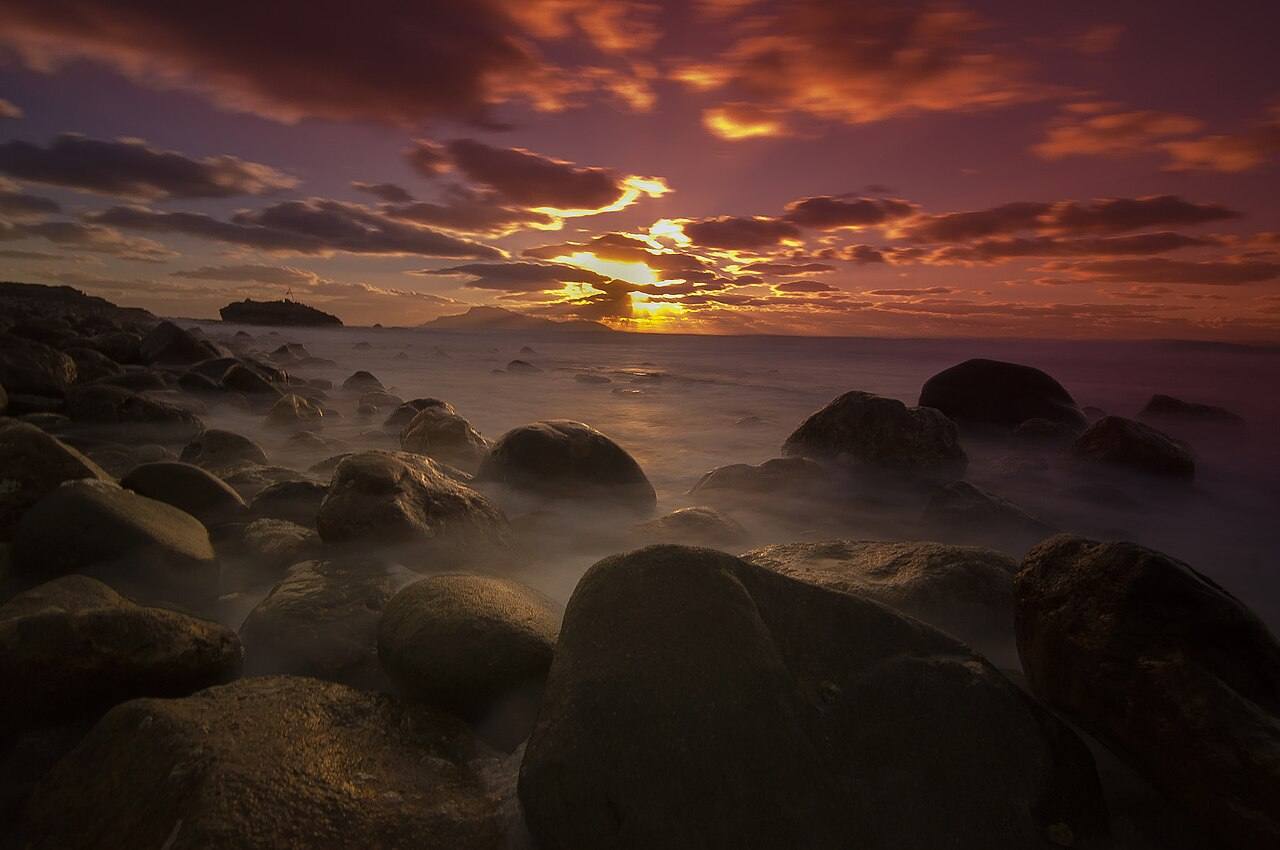 A golden sunset over the sea on Karpathos, a romantic backdrop for a wedding celebration