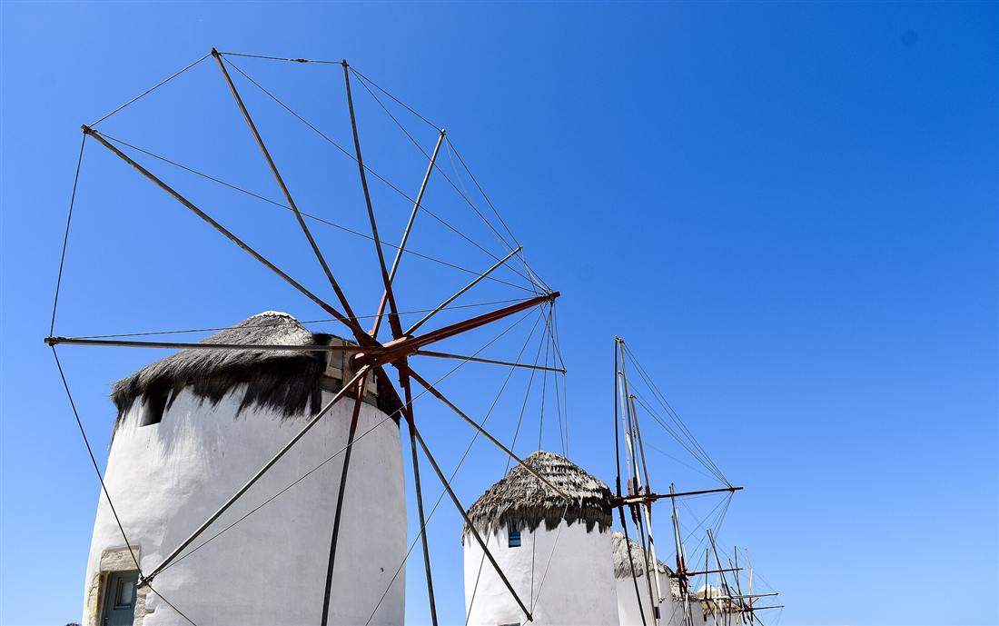 The row of windmills above Mykonos Town, the island reached by airport transfers from Mykonos Airport