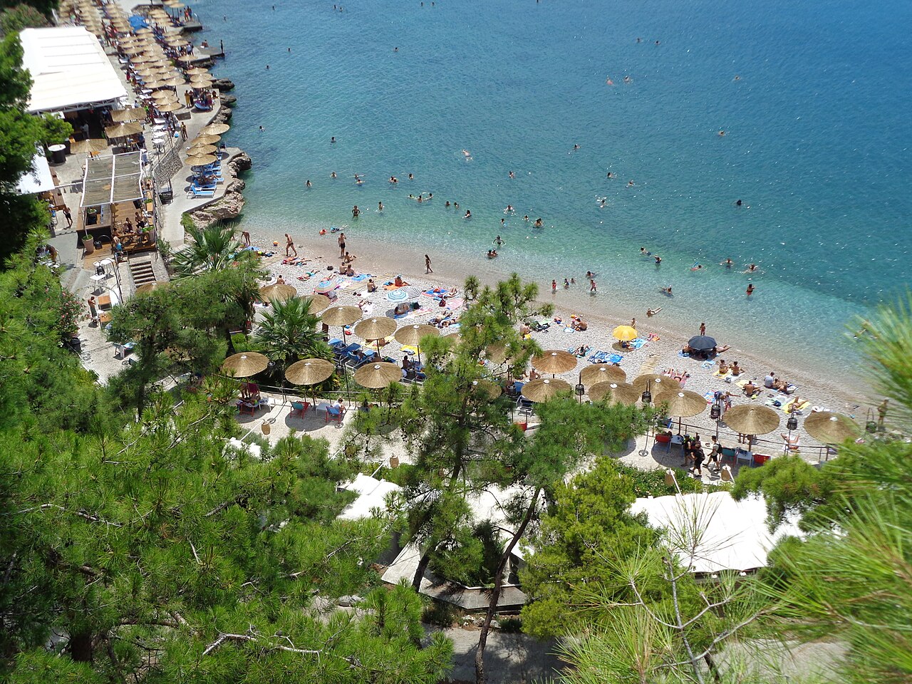 Arvanitia beach in its cove beneath the fortresses of Nafplio