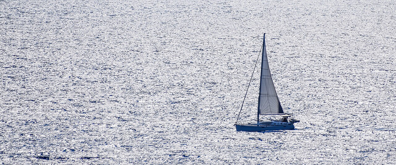 A sailing boat on the blue Greek sea, like a Nafplio gulf cruise