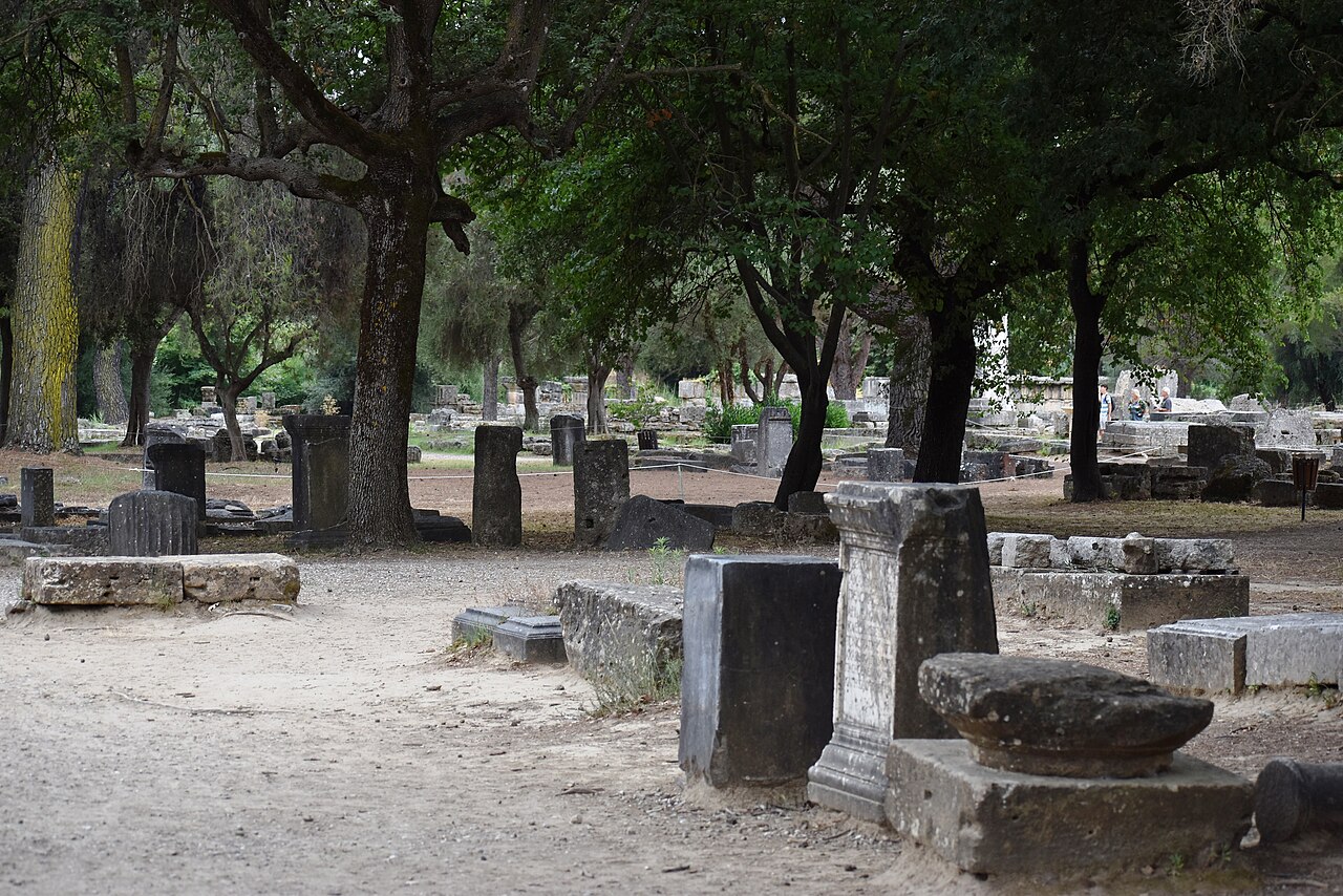 The archaeological site of Ancient Olympia among the trees, covered by the combined entry ticket