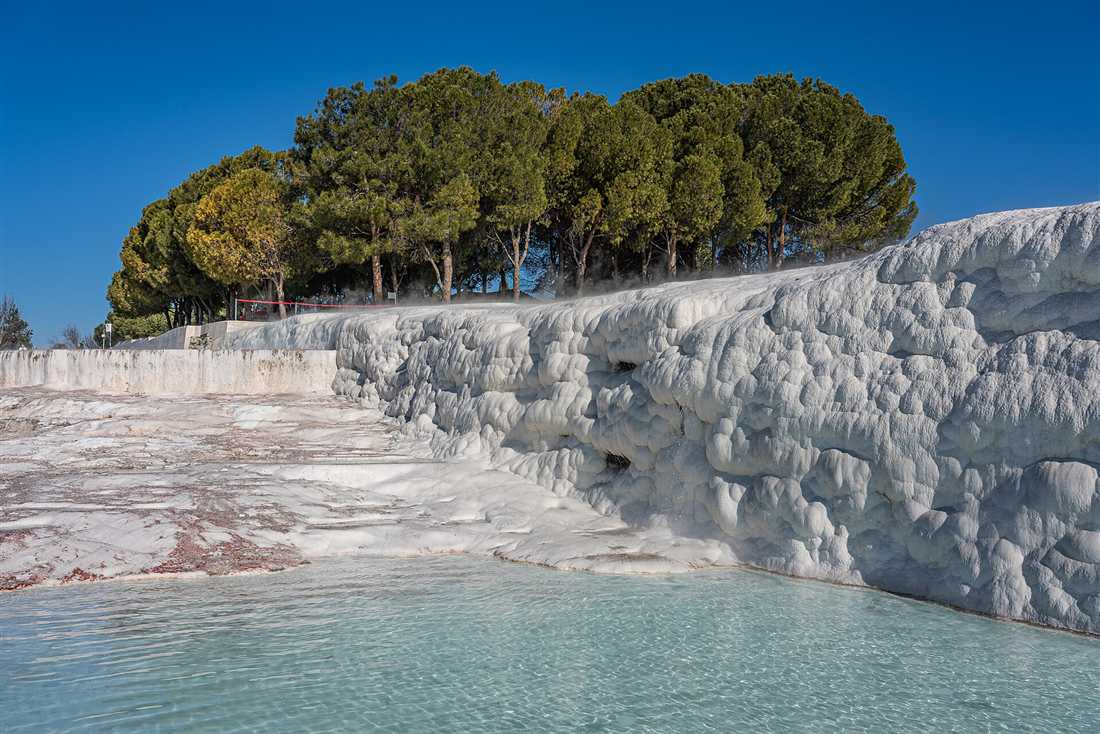 The white travertine terraces and thermal pool of Pamukkale, on the combined entrance ticket