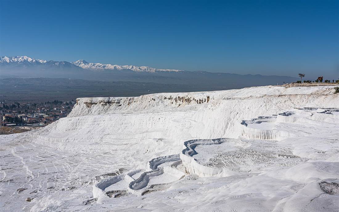 The white travertine terraces of Pamukkale, one half of an Ephesus and Pamukkale tour