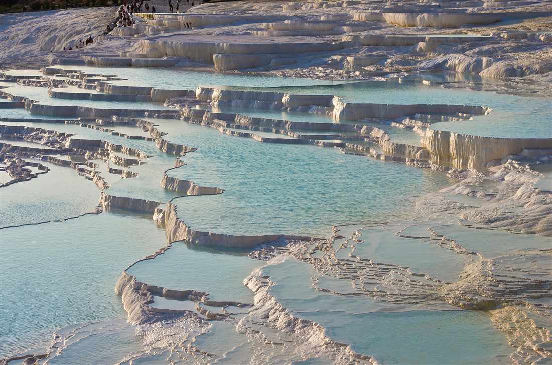 Visitors on the white travertine terraces of Pamukkale