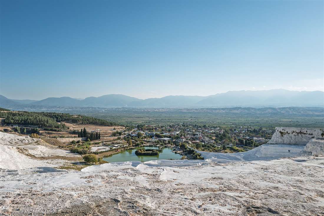 The white travertine plateau of Pamukkale above the Denizli valley