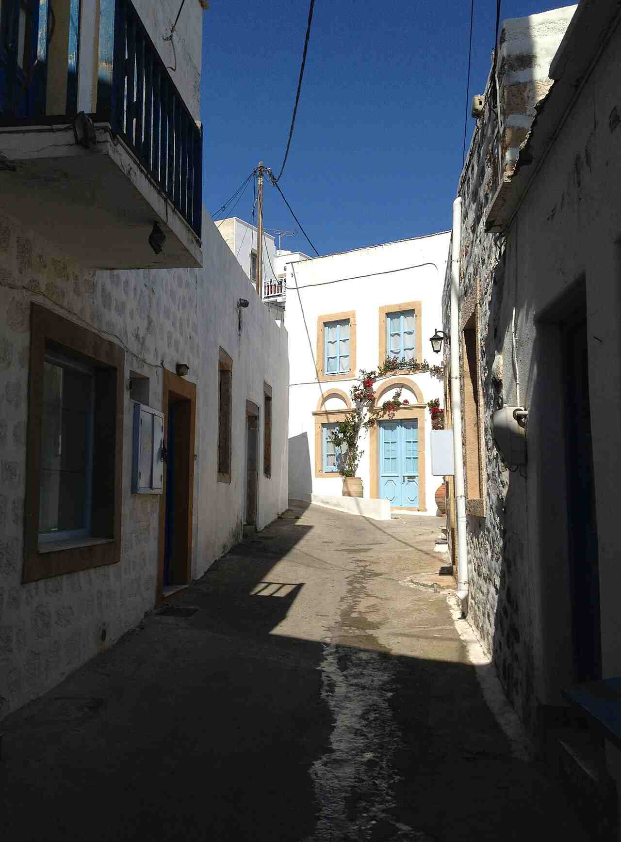 A quiet whitewashed street in the port town of Skala, Patmos