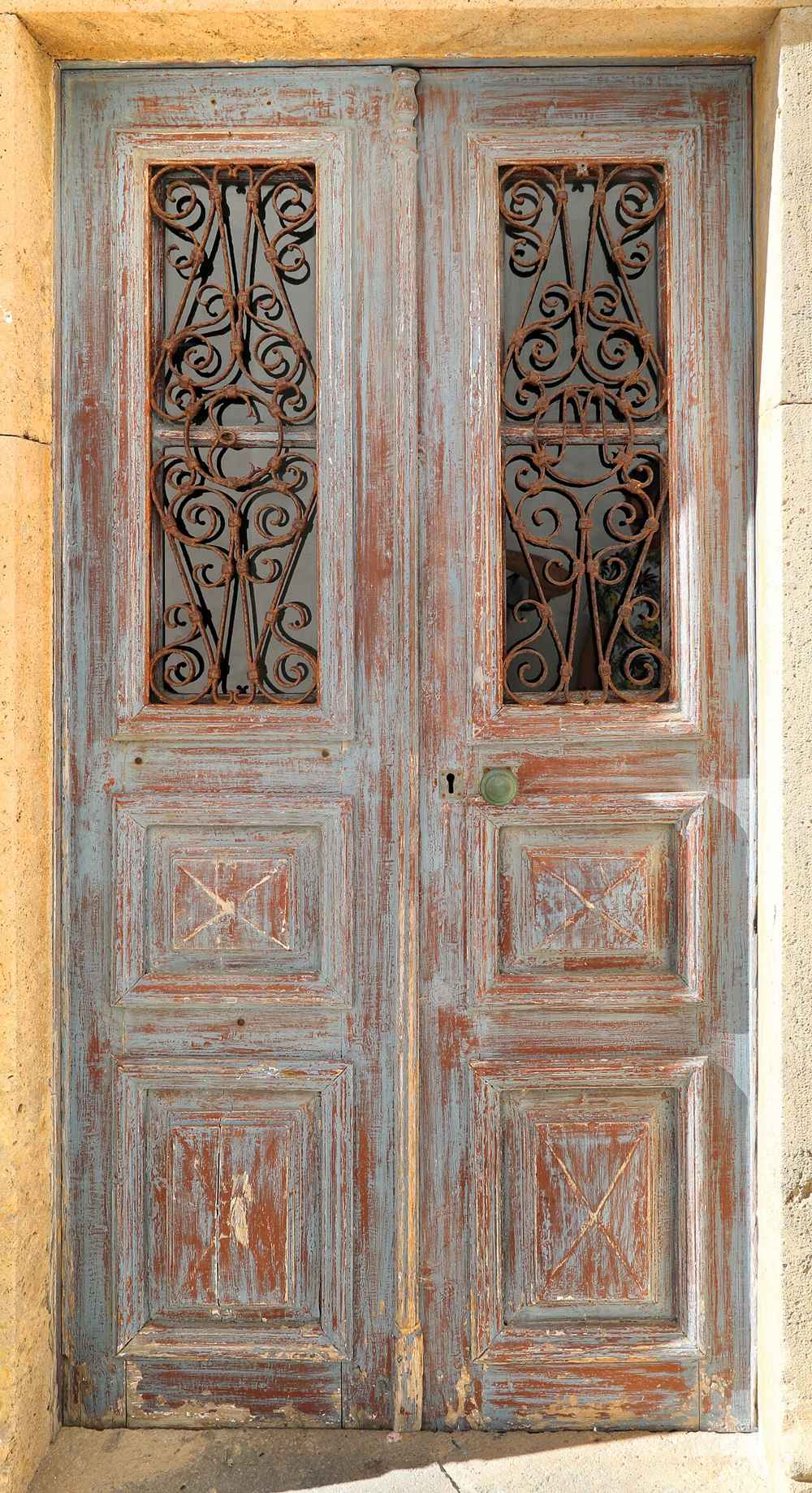 A weathered blue door in the lanes of Chora, Patmos