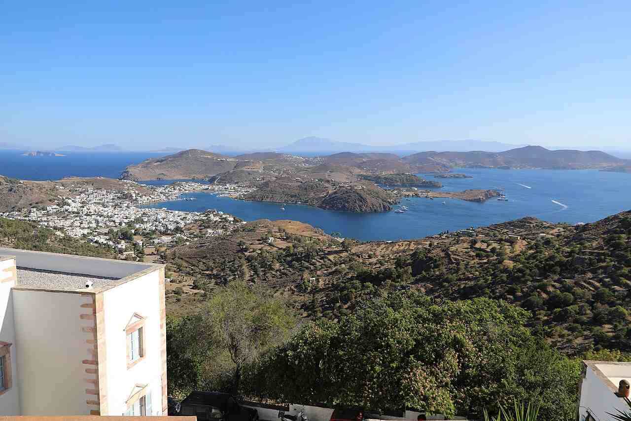 View over the whitewashed houses of Chora and Skala bay, Patmos