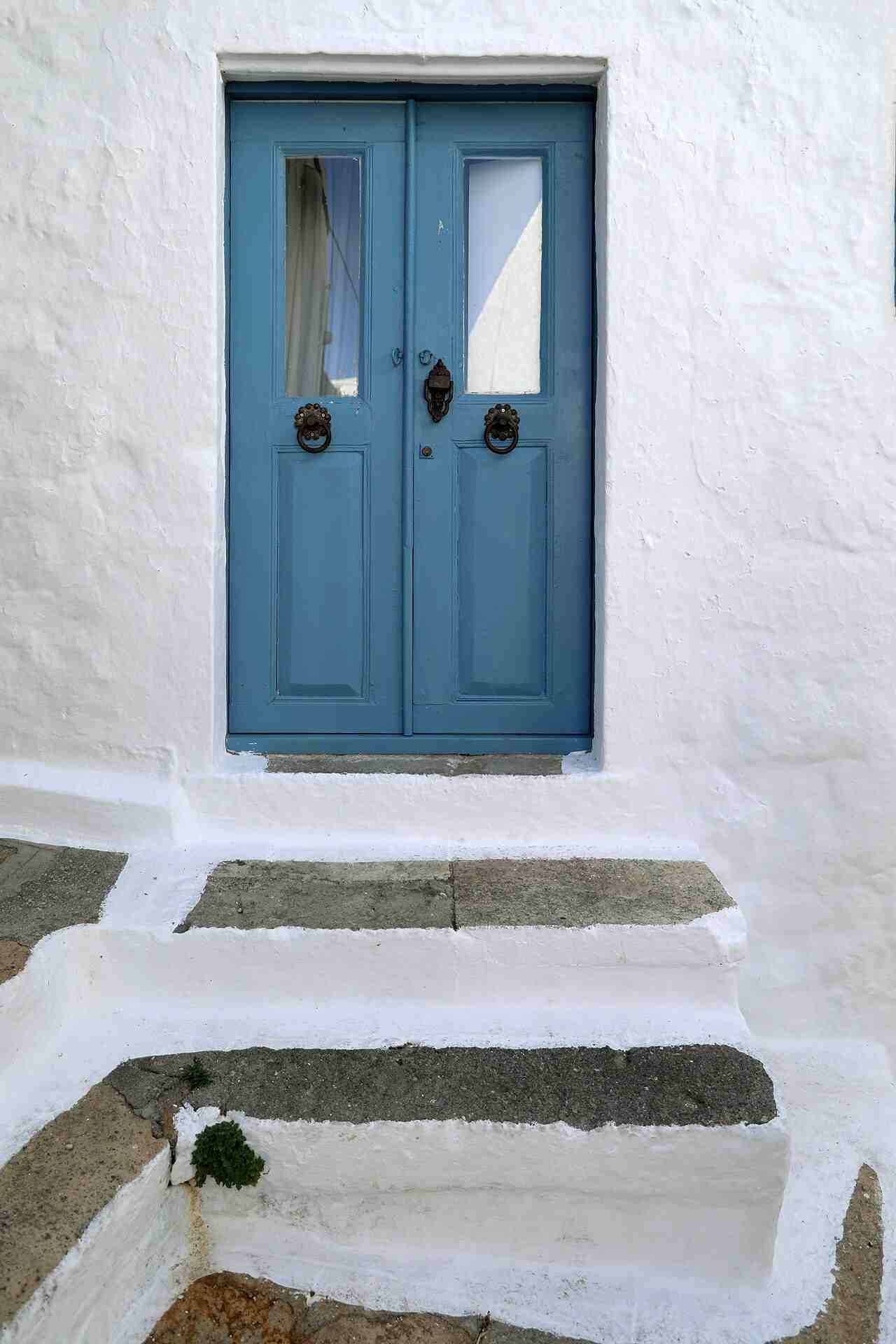 A blue door and whitewashed steps in the lanes of Chora, Patmos