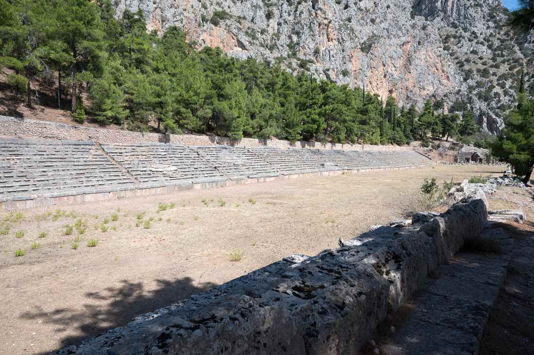 The long ancient running track of the Stadium of Delphi beneath the cliffs, venue of the Pythian Games