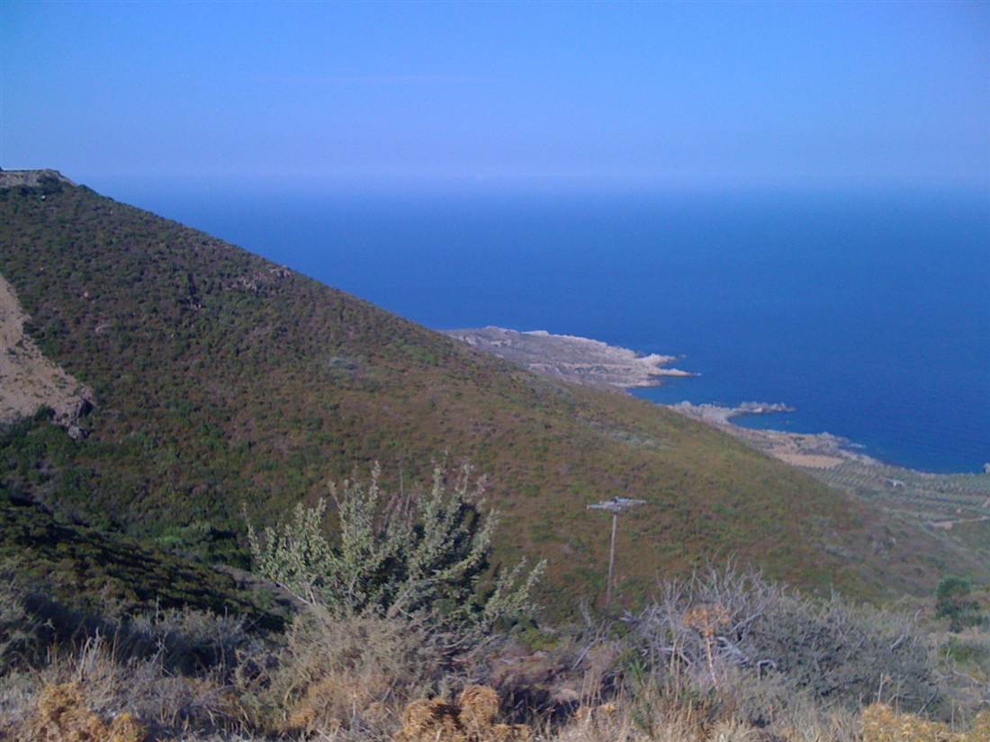 The green hillside descending to the wild Sfinari coast on the west of Crete