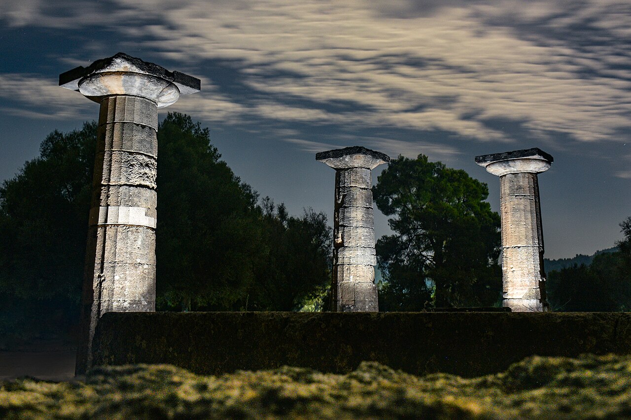 Temple of Hera at Ancient Olympia, its Doric columns standing in the green valley where the Olympic flame is lit
