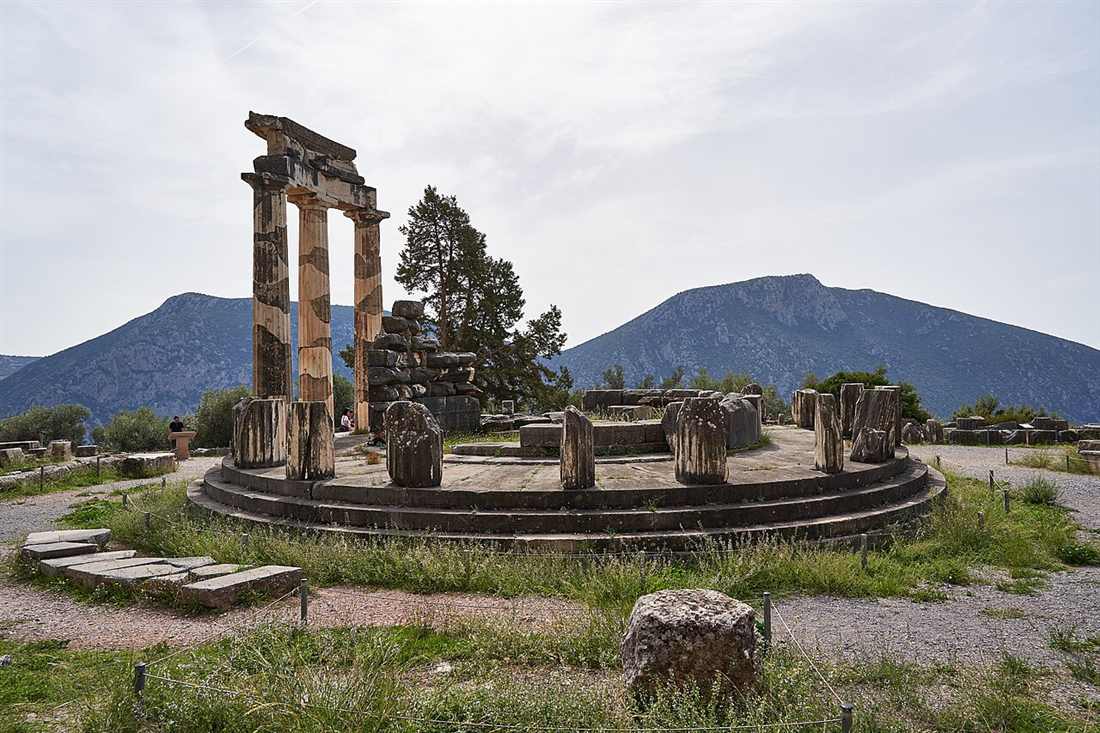 The Tholos of Athena Pronaia at Delphi, the round three-column temple that is the icon of the sanctuary, against the mountains of Parnassus