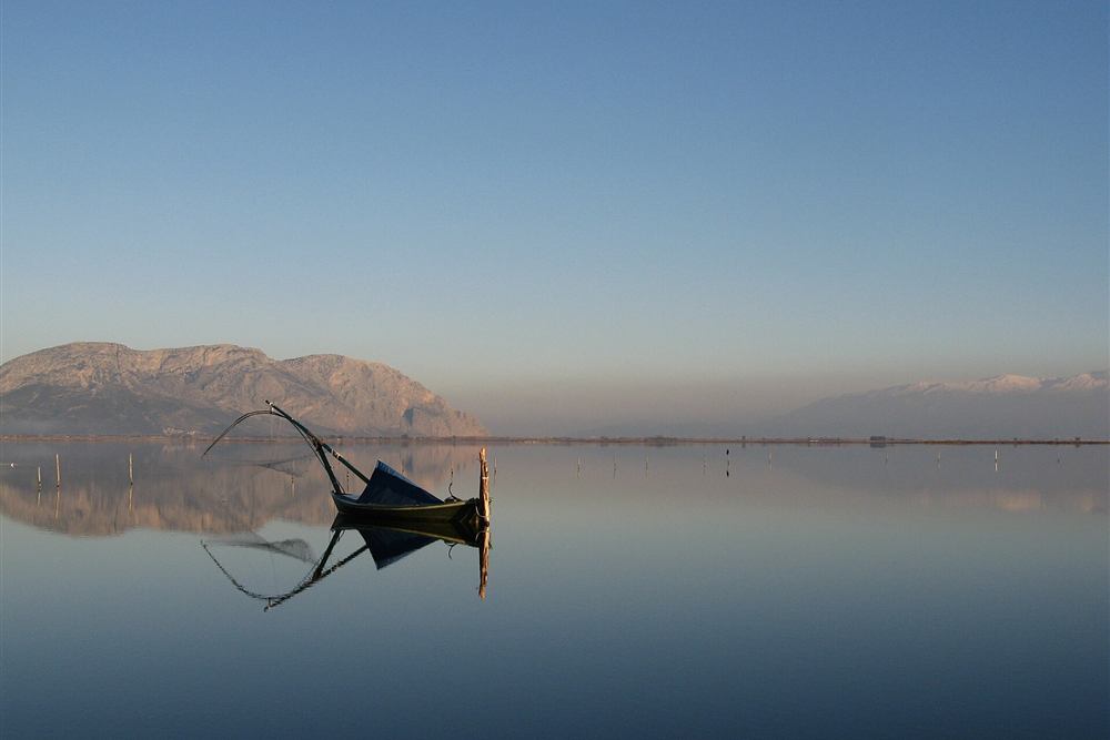 A fishing boat on the Messolonghi lagoon at dawn