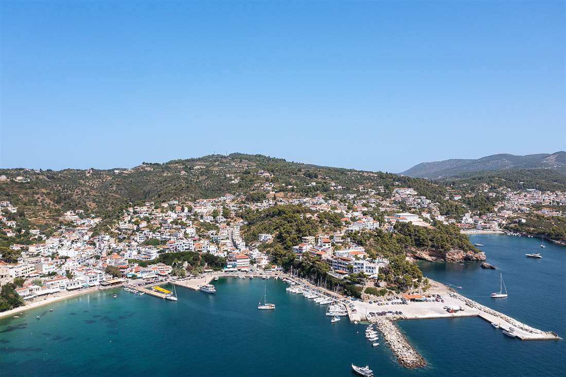 Sailing yachts moored in the harbour of Patitiri on Alonnisos, gateway to the National Marine Park, a base for an Alonnisos yacht charter