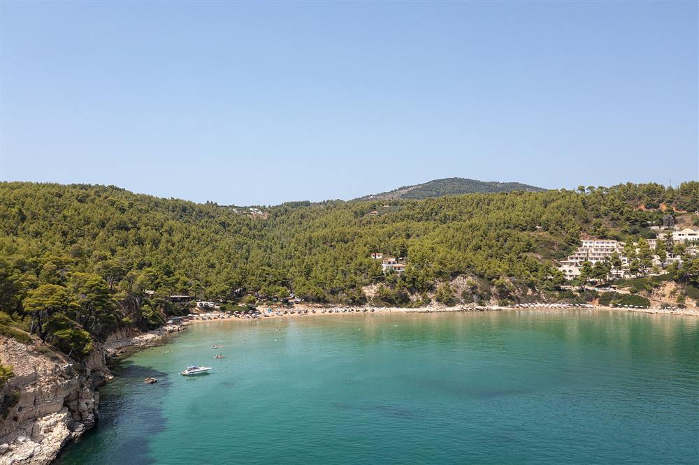 The turquoise pine-fringed bay of Chrisi Milia beach on Alonnisos in the Sporades