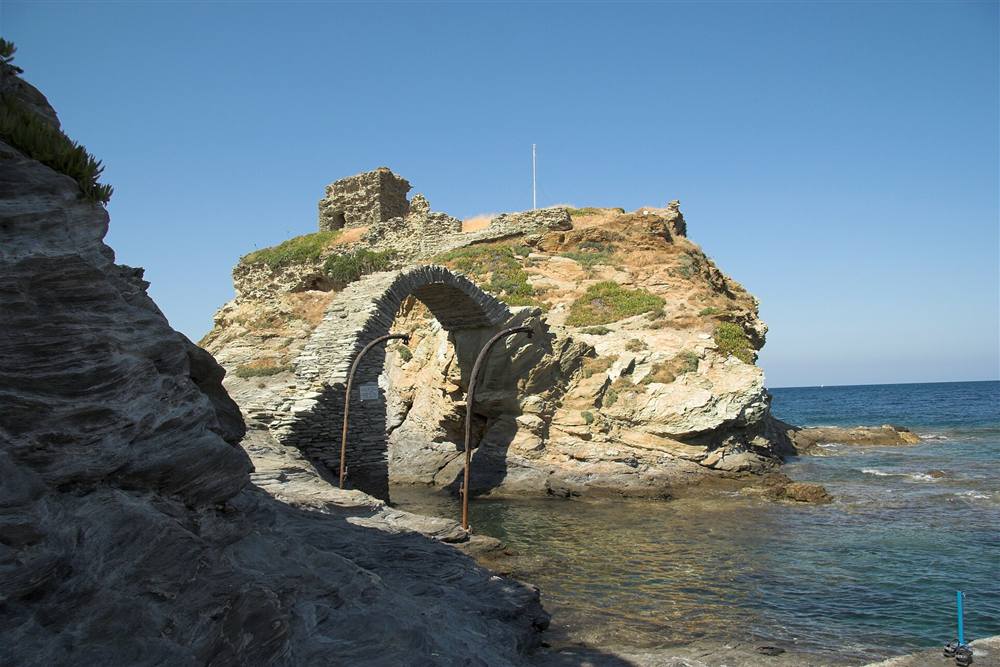 Venetian castle of Chora on its islet with the stone arch bridge, Andros