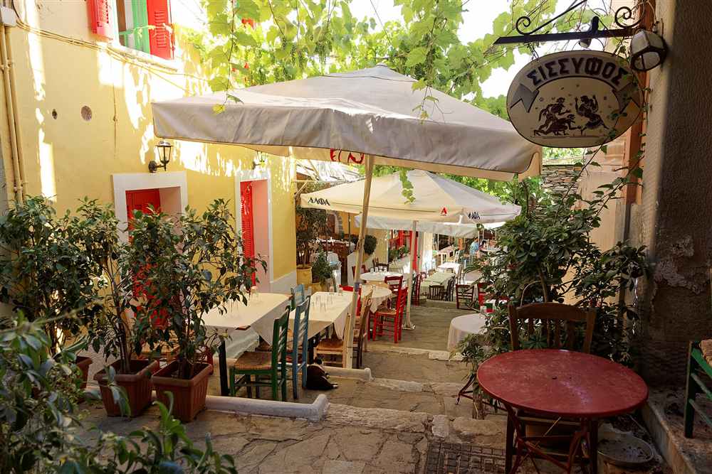 Taverna tables on the Plaka steps where the Athens Greek night dinners are served