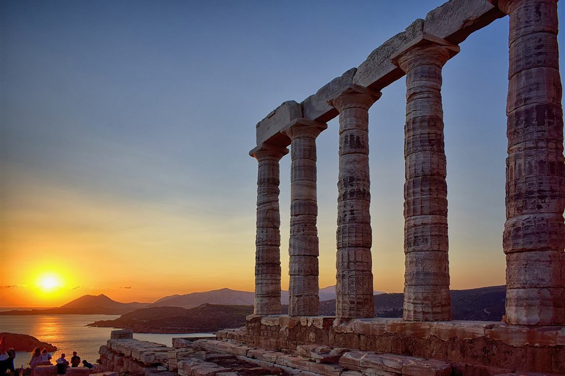 Temple of Poseidon at Cape Sounion at sunset above the Aegean