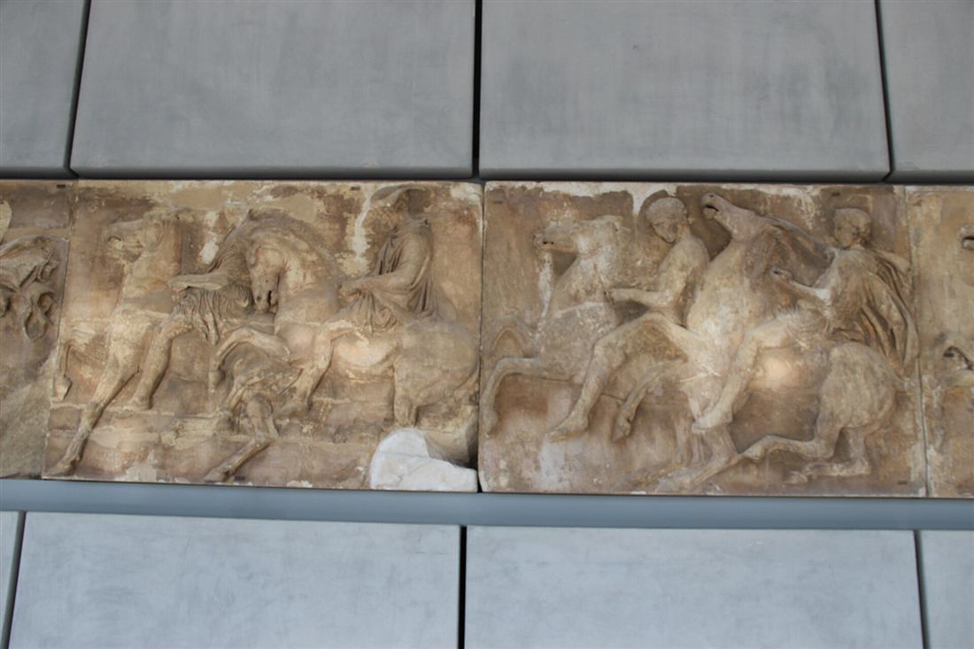 Carved marble horsemen of the Parthenon frieze in the Acropolis Museum, the relief carving tradition behind an Athens marble carving workshop