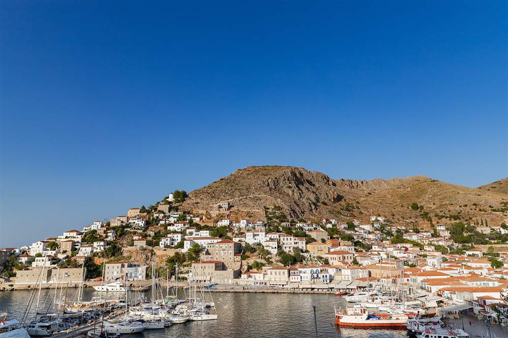 Sailing yachts moored in the amphitheatre harbour of Hydra in the Saronic Gulf near Athens