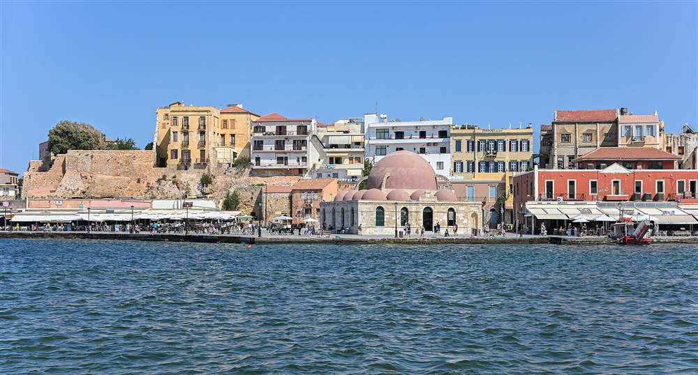 The domed Kucuk Hasan Mosque on the old Venetian harbour of Chania, Crete