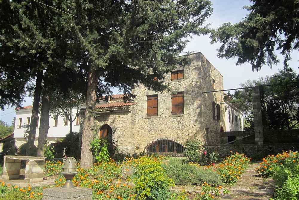 Stone buildings and herb garden of the Dourakis winery in Apokoronas, Chania