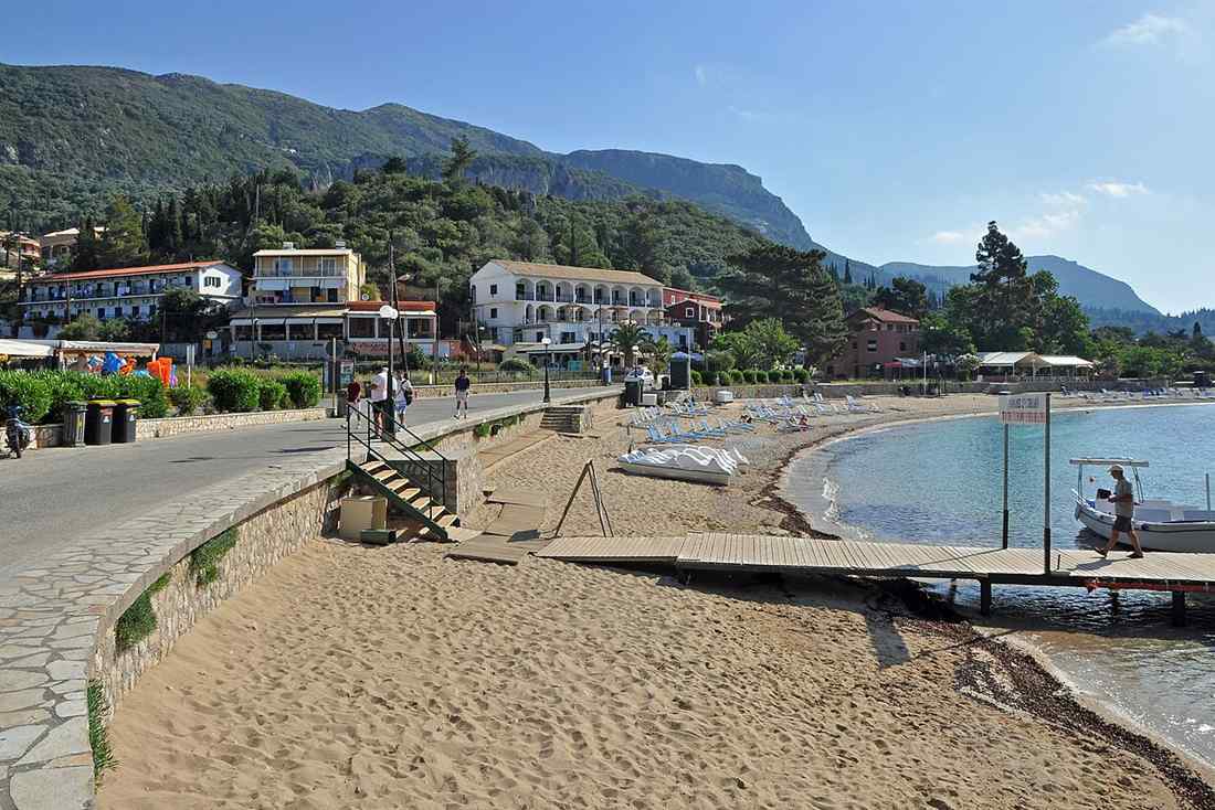 The beach and jetty at Paleokastritsa on Corfu where the hire boats are moored