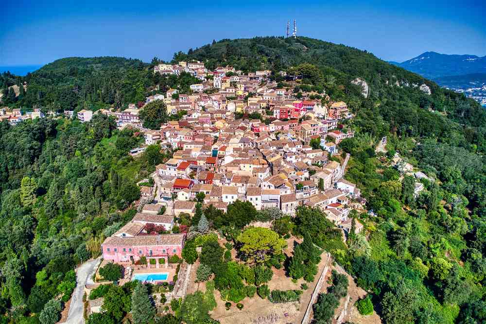 Aerial view of the hill village of Chlomos in the green south of Corfu