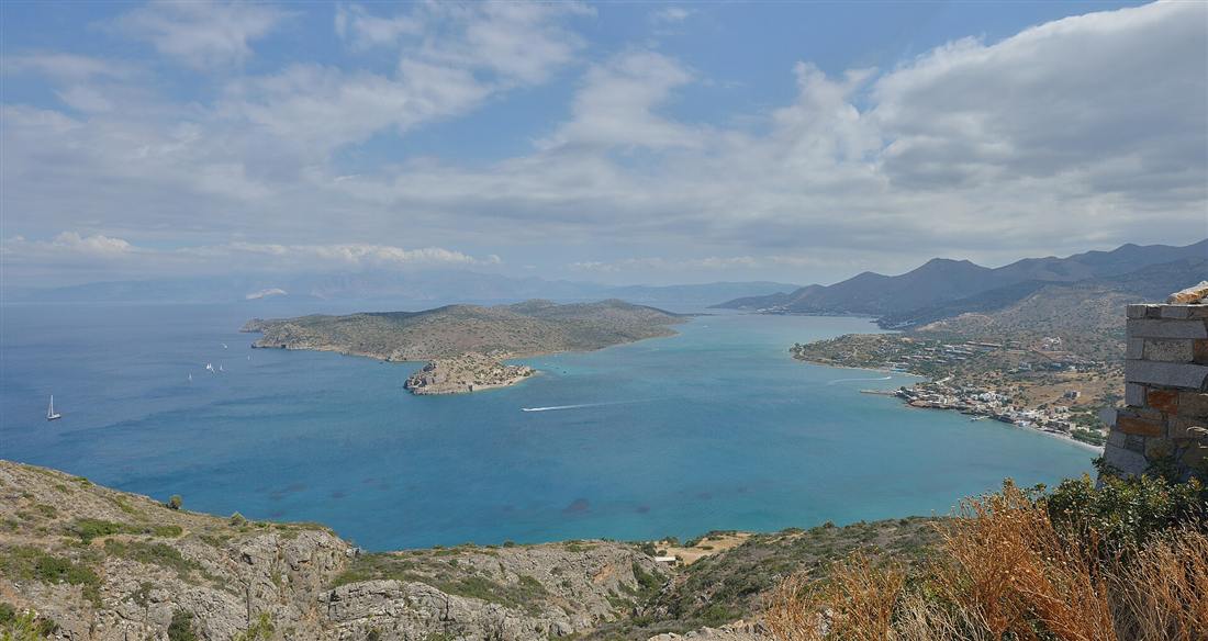 The turquoise water of Mirabello bay with the islet of Spinalonga off Elounda, the sheltered ground worked on Crete fishing trips