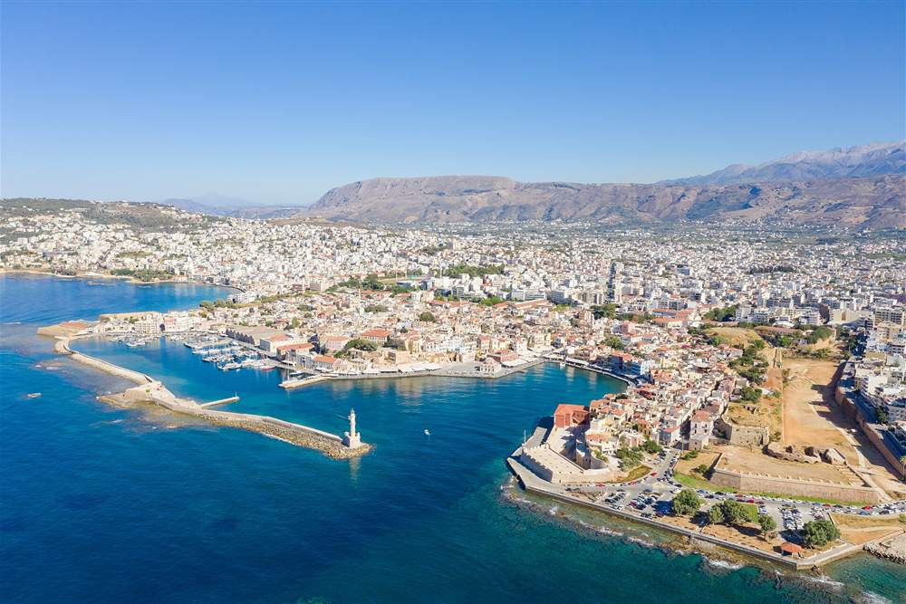 Aerial view of the Venetian harbour, lighthouse and old town of Chania, Crete