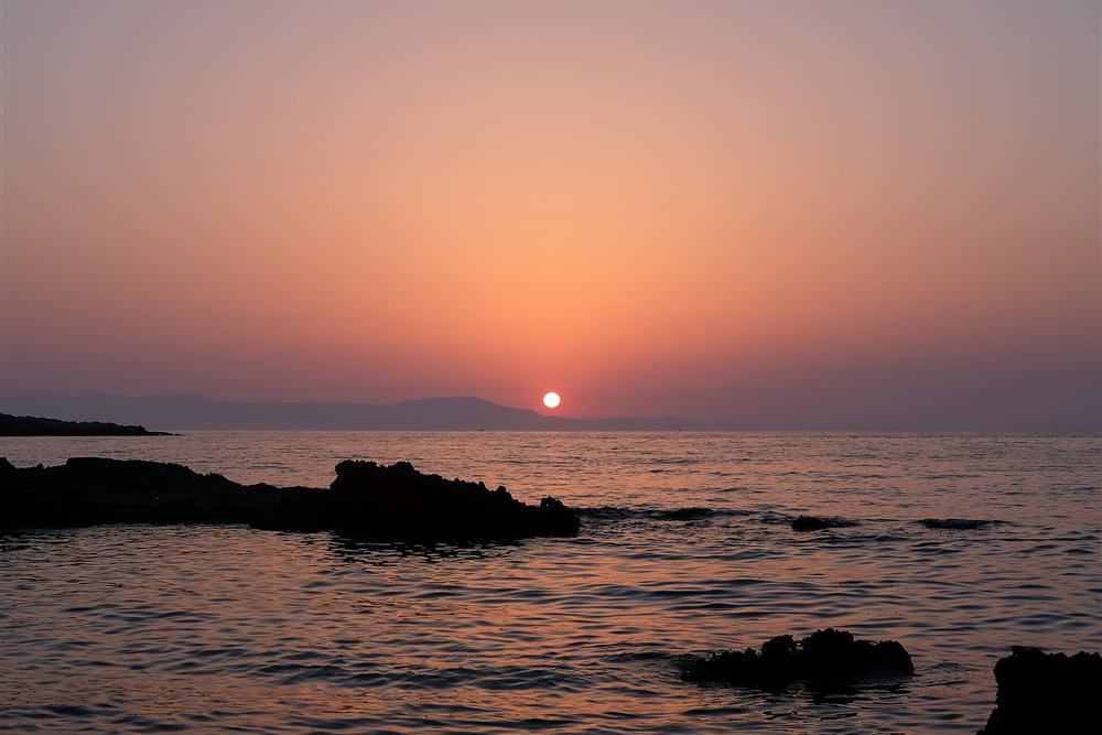 Calm sea at sunset off Kalathas beach near Chania, the setting for a sunset Crete stand up paddle session