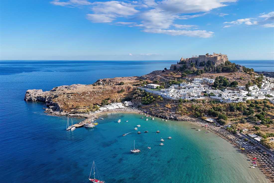 Acropolis of Lindos above its bay on Rhodes on a Dodecanese tour
