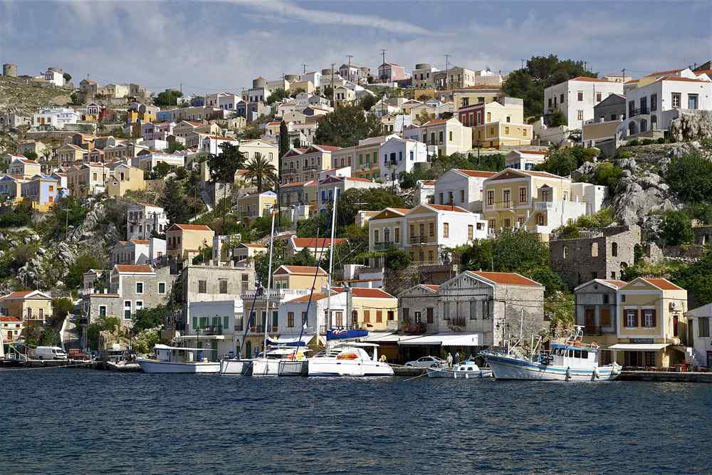 Neoclassical houses of the Symi harbour on a Dodecanese tour