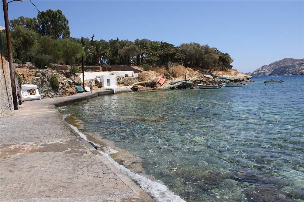 The clear shallow water and moored boats of the Agia Pelagia shore on the north coast of Crete