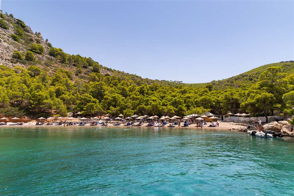 Turquoise water at Bisti beach on the west coast of Hydra, reached by boat