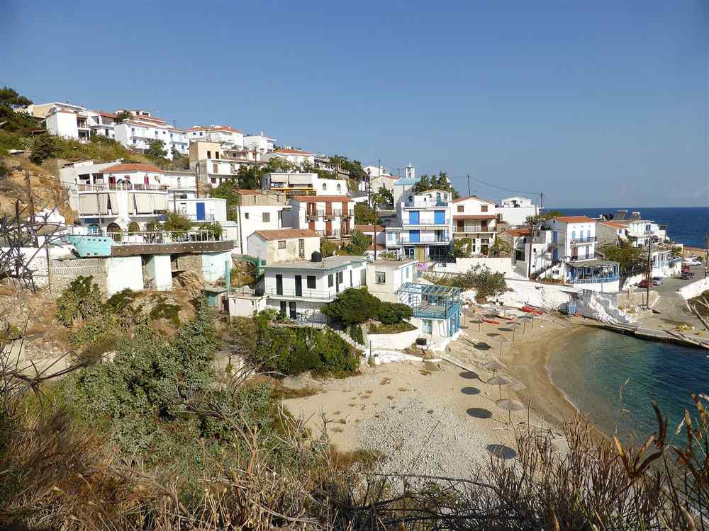 The whitewashed hillside village and cove of Armenistis on Ikaria, Greece