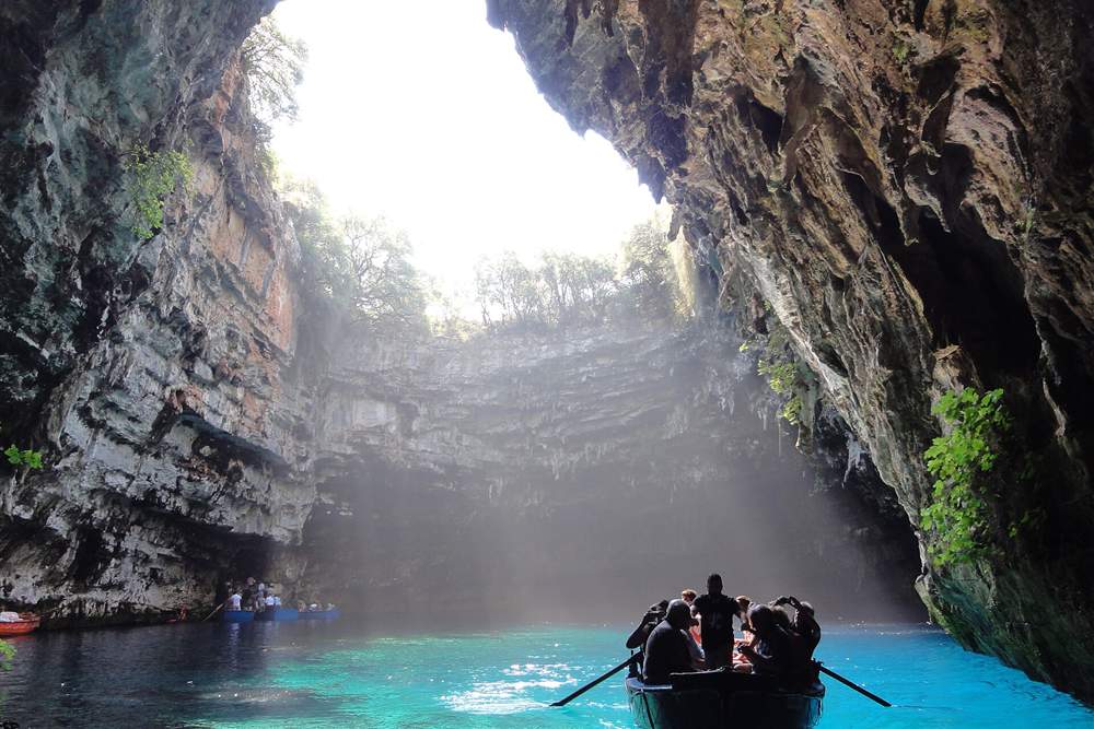 Boat on the underground lake of Melissani on Kefalonia on an Ionian islands tour
